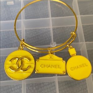 Gold plated bangle with charms